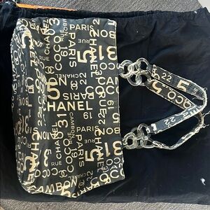 Black Graphic Shoulder Bag with Beige Text Pattern